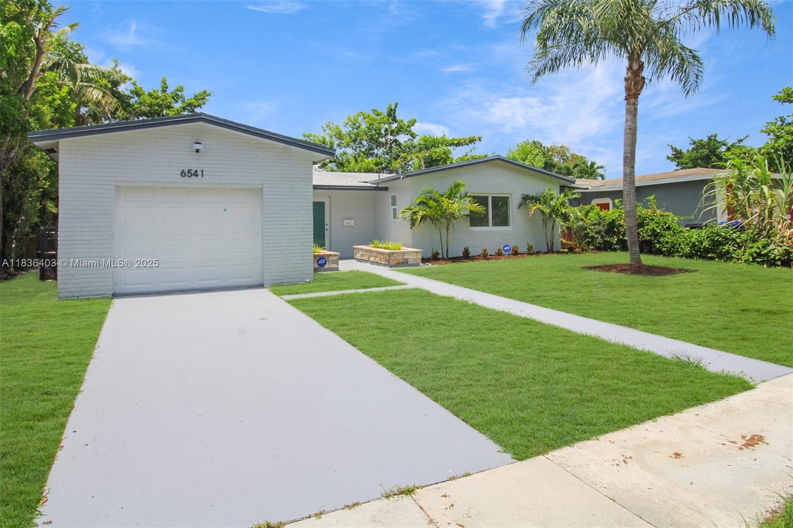 Fully Remodeled Turnkey Home! This stunning, move-in-ready property has been completely remodeled with high-quality finishes and modern upgrades throughout. Features include a brand-new roof, impact windows, and new tile flooring. The kitchen has been fully renovated with all-new cabinetry and upgraded stainless steel appliances. Both bathrooms have been beautifully updated with new vanities, mirrors, and modern fixtures. Enjoy new lighting throughout the home, enhancing its bright, open feel. Additional highlights include a covered terrace, attached garage, and fresh landscaping for great curb appeal. Don’t miss this opportunity to own a fully updated home with no detail overlooked. Room for a pool. Truly the gem of the neighborhood. No association.