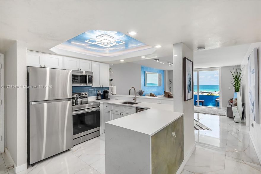 Direct oceanfront SE corner w/2nd floor parking included offered over $100,000 below the most recent sale! Sellers loved it so much that they bought & combined 2 units & are selling this unit for a great price. Newly remodeled w/large format porcelain floors, spectacular fully equipped open kitchen w/quartz countertops w/waterfall edge, impact windows & doors, venetian plaster finishing, custom lighting & electric blinds-no expense spared & furniture can be included! Largest unit in building w/generous foyer, adorable bar area w/wine cooler, spacious bath w/room for washer dryer (which is allowed), natural light in every room, & more.  South of 5th w/oceanfront heated pool, gym, complimentary beach service w/chairs & umbrellas, & low fees that include reserves. Seller financing available.