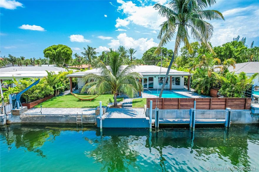 Designer-renovated turn-key home in the prestigious, gated neighborhood of Keystone Islands. Offering 75 feet of water frontage, on a 35 ft deep T-Canal. Property is on Bayview Lane, which is the most desirable street in the island.  It is not a through street, there is no traffic. It is known to have the highest elevation out of all the islands. Therefore, it has never flooded with any storm.  The property is just 3 minutes to the Bay by boat, and 10 minutes to the ocean with no bridges or boat traffic. There is enough space to dock two boats. Water & electric are at the dock. Recently remodeled designer home with custom Restoration Hardware furniture and artwork throughout. Just bring your suitcase and toothbrush!  House is turn-key, with no need to wait for new furniture.