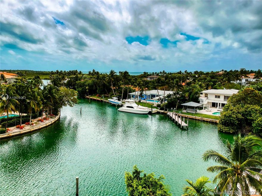 Two docks of 65 feet and 20 feet at 45 degree angle to sea wall which is 100 feet. 
Renovated house.
loft style 5 bedrooms 6 baths.5,429 Adj S.F , 14,880 S.F lot,2,622 S.F terraces, 213 S.F gazebo.
Huge terraces surround all second floor and bedrooms providing social area to each room.
Huge crawl space under house with plumbing and electric lines through.Elevated above code on pilings.
All common living areas pool and backyard  face East and beautiful sunrises . Gazebo by swimming pool, mango and avocado
 trees .Marble floors. Art Deco White coral and teak staircase.
2,622 S.F of terrace space surround the house