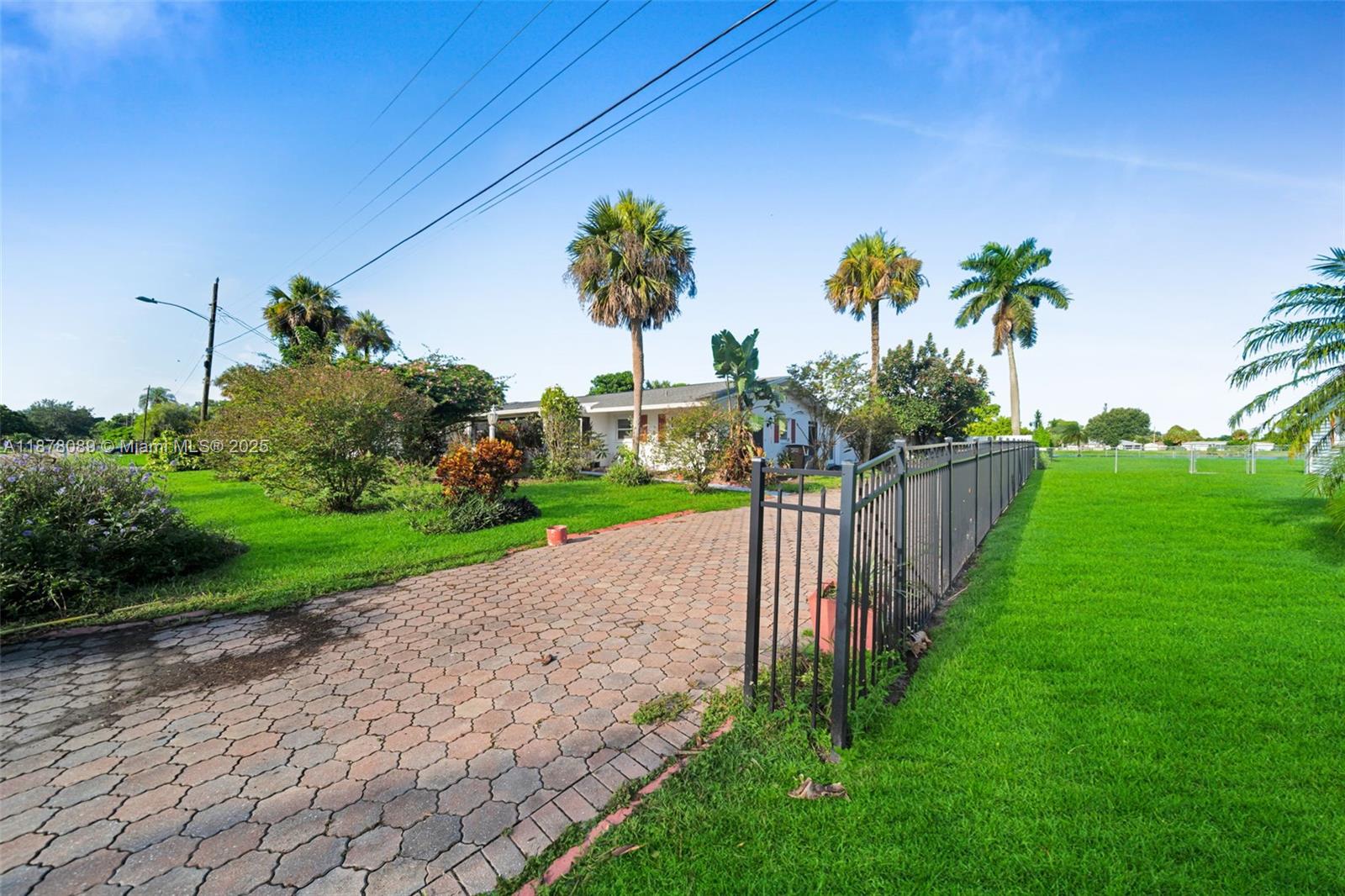 Discover lakeside living on this spacious half-acre lot featuring a beautifully maintained 3-bedroom, 2.5-bath home. Perfectly situated in a desirable Lehigh Acres location, this property offers the ideal blend of privacy, space, and convenience. Enjoy serene lake views right from your backyard-perfect for relaxing evenings, entertaining guests, or creating your dream outdoor oasis. With its excellent location close to shopping, dining, and schools, this home is a rare opportunity you don't want to miss!