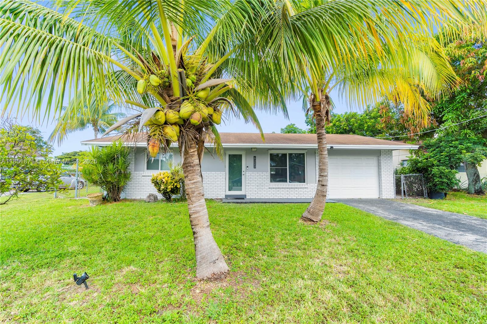 Experience the best of Florida living in this well-maintained 3-bedroom, 2-bathroom pool home, situated on a canal in a welcoming and family-friendly neighborhood with no HOA. Designed for both comfort and functionality, this home also features an upgraded primary bathroom and a spacious family room that offers the perfect setting for entertaining or relaxing with loved ones. The hurricane impact windows and doors ensure year-round safety and energy efficiency, while the beautifully landscaped exterior serves as a private tropical retreat. Enjoy the serene ambiance complete with a sparkling pool and coconut trees.