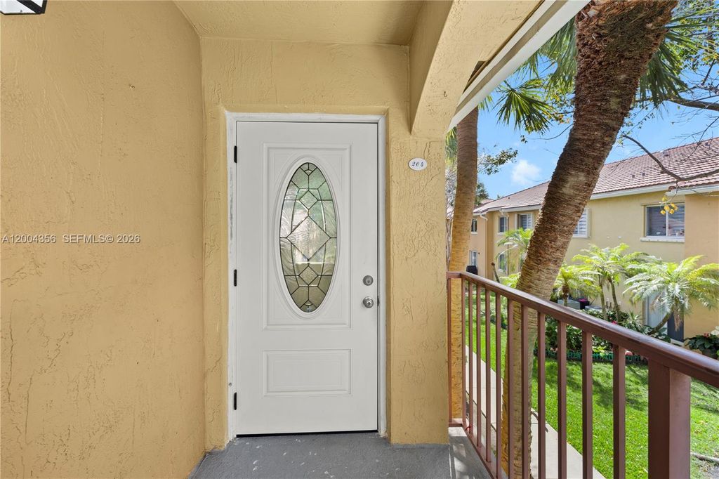 Photo of 631 NW 79th Ter #204, Pembroke Pines, FL 33024 (MLS # A12004356)