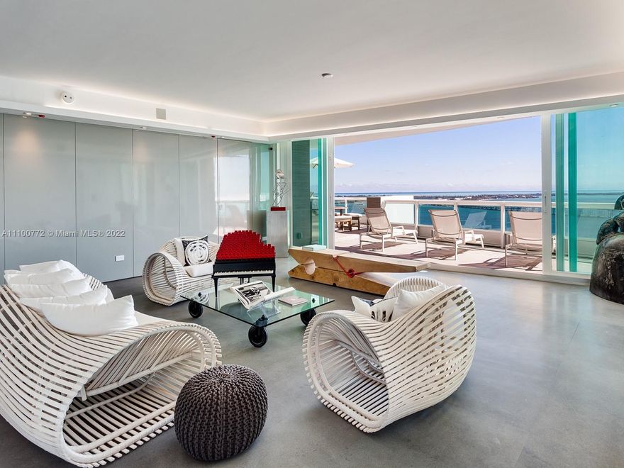 This luxe residence on the 27th floor of the Santa Maria tower on Miami’s Brickell Avenue was recently completely renovated to become a serene contemporary space. With spectacular views to the east and west, overlooking Biscayne Bay, the Miami skyline, and the ocean in the distance, this floor-spanning unit is one of only two in the building with extra-deep, landscaped terraces like this. A centerpiece of the unit is the glass wine cellar, which is connected to the full wet bar. The Santa Maria offers a resident clubhouse in a historic mansion on the lush grounds, a large fitness center on the building’s rooftop, a bayfront pool, a marina, tennis courts, and a location in the heart of Miami, with excellent access to the excitement of Downtown Miami and Coconut Grove.