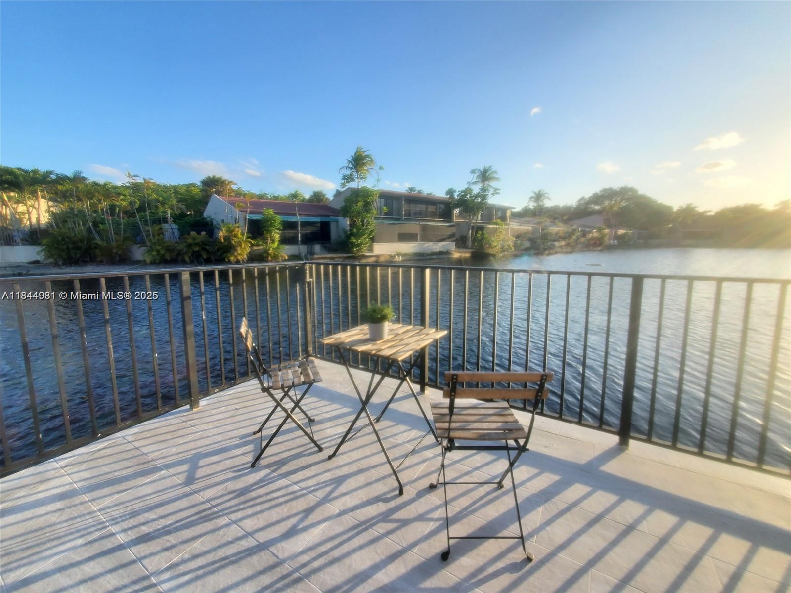 STUNNING WATERFRONT CORNER HOME IN A GATED COMMUNITY with A-RATED SCHOOLS! RENOVATED 2BR/2.5BA with LOFT/Xtra ROOM! Relax in this resort style home with rare water access on two sides. Features include an Updated Kitchen with Granite Waterfall Countertops, Custom Cabinets, Smart Features, Premium Appliances, dramatic Spiral Staircase, soaring Ceilings & Large Closets. Two spacious Master Suites on the first floor with 2 1/2 Remodeled Baths. Upstairs LOFT is perfect as an OFFICE or optional 3rd BEDROOM. Smart home upgrades include Wireless Charging & USB outlets. Enjoy serene Lake Views from the Screened Patio or Launch a Kayak from your Private Deck. Located in top-rated MAGNET SCHOOL Zone for MS & HS. This Unique Corner Home is truly a RARE FIND! Schedule your Private Showing TODAY!