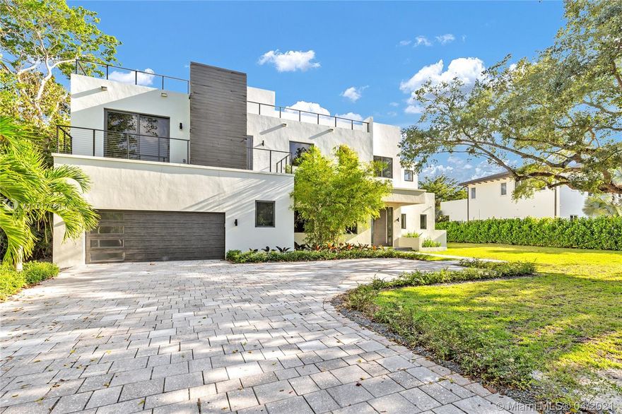 Stunning Brand New Modern House with a great floor plan and volume ceilings in the highly desirable Ponce Davis area. This gated, 7 bedroom, 8.5 bathroom home, sits on over a 23,000 SF Lot just off Ponce De Leon.
The floor plan includes a spacious living room with stunning views to the beautiful backyard, a grand kitchen with dining area, space for bar and wine cellar, elevator shaft, large master bedroom and bathroom with his and hers walking closets,  a guest house and an incredible roof top, ideal for entertaining. This spectacular house is a must see! Square ft. per architect/developer plans. Tax roll sf. is for old house. New sf. as per architect/developer: Living Area 6,198 sf., Total Area 7,904 sf. including the rooftop terrace.