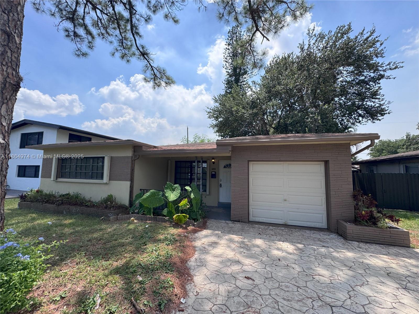 Discover an exceptional opportunity at 6844 SW 12 St, a property that combines comfort, convenience, and potential. This inviting home is nestled in a highly sought-after neighborhood, offering easy access to local amenities, top-rated schools, and major transportation routes.