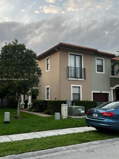 Centrally located full and hard to find, 4 bedroom, 3 bathroom corner townhouse unit with 1-car garage. Fully tiled on the first floor and carpeted on the second. Formal dining room, family room, patio for entertaining, huge master bedroom with master bathroom that has shower and roman tub, kitchen with large pantry, washer and dryer room on second floor, loft area in the second floor for additional space, community pool all contained within a closed community. One complete bedroom and bathroom located on the first floor of the townhouse. Accessible hospitals, shopping, grocery, entertainment all located within close proximity to the community.