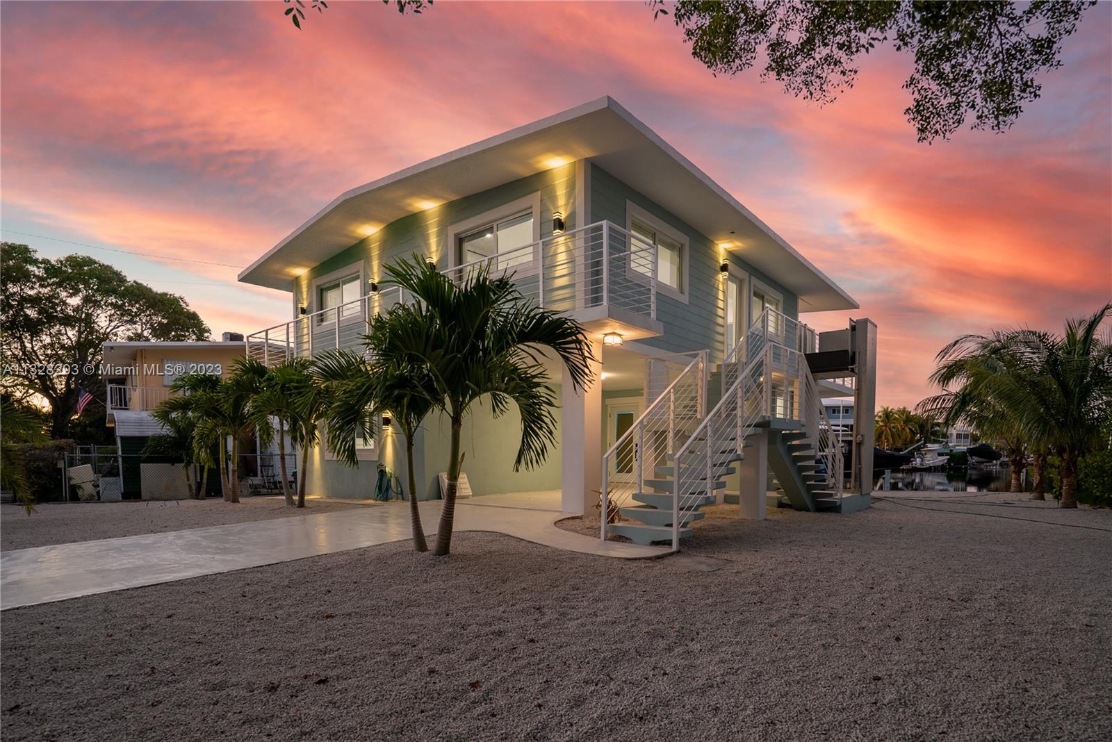 Welcome to 774 Canal St, your Keys Dream Home! Large waterfront lot Located on a Wide turning basin
has spectacular unobstructed views down the Canal, Lushly landscaped yard  2 Story Concrete home w/Impact windows, doors,Exterior Personal Lift,tiled & Covered Carport. Downstairs w/Spacious Storage areas, Full bath, Double Closets,Modern Wet bar with 2 wine/beverage refrigerators.  Upstairs there are 2 beds, 1 full bath High Quality materials & Top of the Line fixtures. Kitchen w/Designer inspired cabinetry, Quartz counter Mosaic backsplash, LG ThinQ Range, French Door Refrigerator that stay connected thru your mobile device
Home has Custom motorized Interior Shades installed throughout. 50’ Seawall with 20k# boatlift  
Large yard has plenty of room for a pool This home is MOVE IN READY!