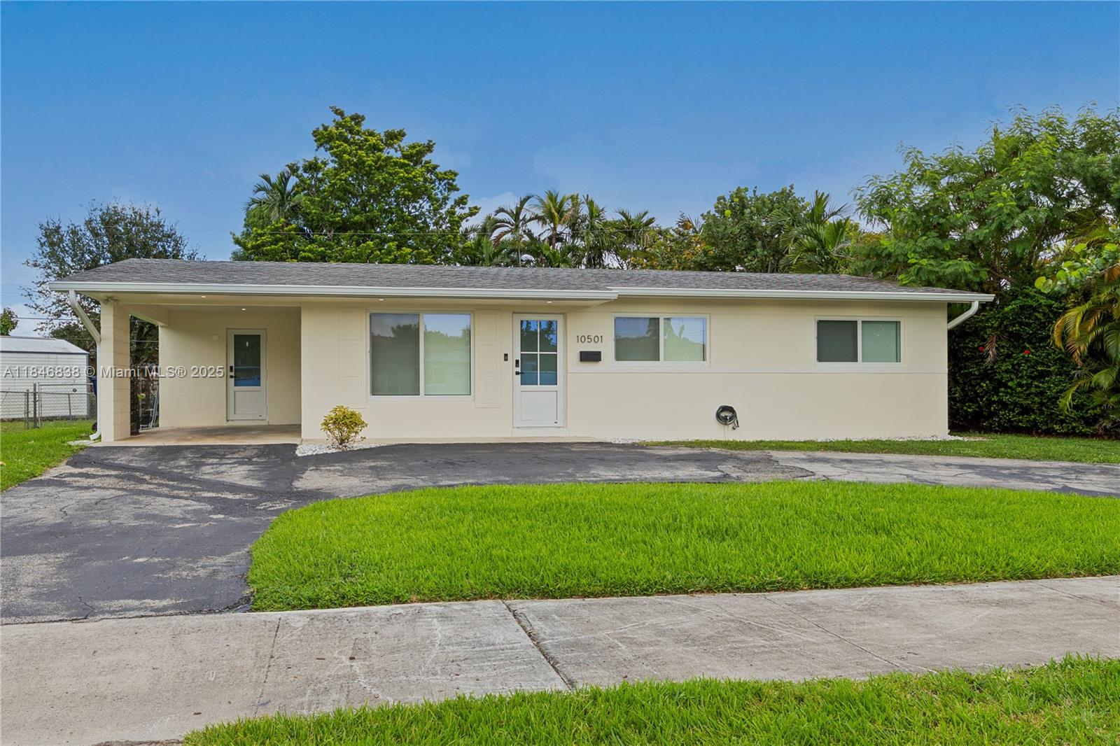 Most beautiful rental on the market! Spoil yourself with this elegantly updated home. Updates in this light and bright home include new vinyl flooring, new spa like bathrooms, white modern kitchen with island, quartz countertop and top of line white glass refrigerator. Built in microwave. Dream laundry room with white modern cabinets, front load washer and dryer. All closets have professional closet organizers. Impact windows and doors throughout. Back covered porch with fans for relaxing or fun barbequing. All new interior doors. Inside and outside freshly painted. Large fenced yard. Tenants must acquire a contents and liability insurance policy. Must have good credit, provide police background check and income verification.