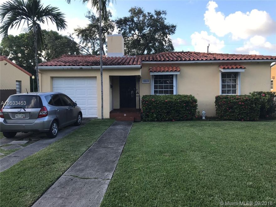 Little Gables opportunity!  Perfect starter home or good money maker for an investor.  Split plan home.  3/2 plus 1 car garage just one block North of Coral Gables limit.  Original wood floors, fireplace, family room tiles, covered screened patio.  Needs update in kitchen and baths, but has potential galore.  Beautiful yard,  fantastic neighborhood.  Newer windows with accordion shutters.  Offered AS IS.  Priced according to recent appraisal.  Show and sell.  Vacant on SUPRA.