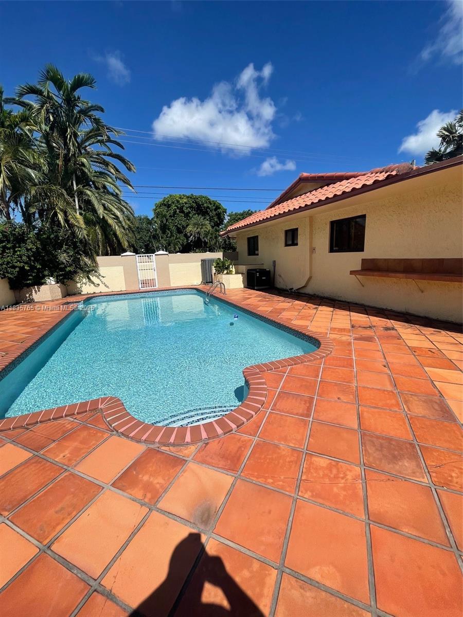 Beautiful and spacious home in highly desirable area of Miami. Magnificent gated one-story estate sitting on a 13000 sqft lot and huge private driveway, located a few blocks away from Tropical Park. 6 bedrooms 4 baths property with marble floors throughout. Huge private fenced backyard and vast common areas are some of the amazing features that make this home an entertainer's paradise! Large master bedroom. Very nice pool and pergola space. Also, entertaining room for parties and family gatherings. Property is conveniently located with a short distance to schools, dining and shopping on prime location, close to South Miami, Coral Gables, all major hospitals and expressways.