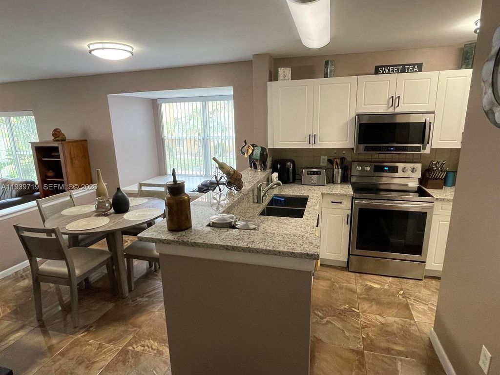 Photo of 4767 Via Palm Lks #208, West Palm Beach, FL 33417 (MLS # A11939719)