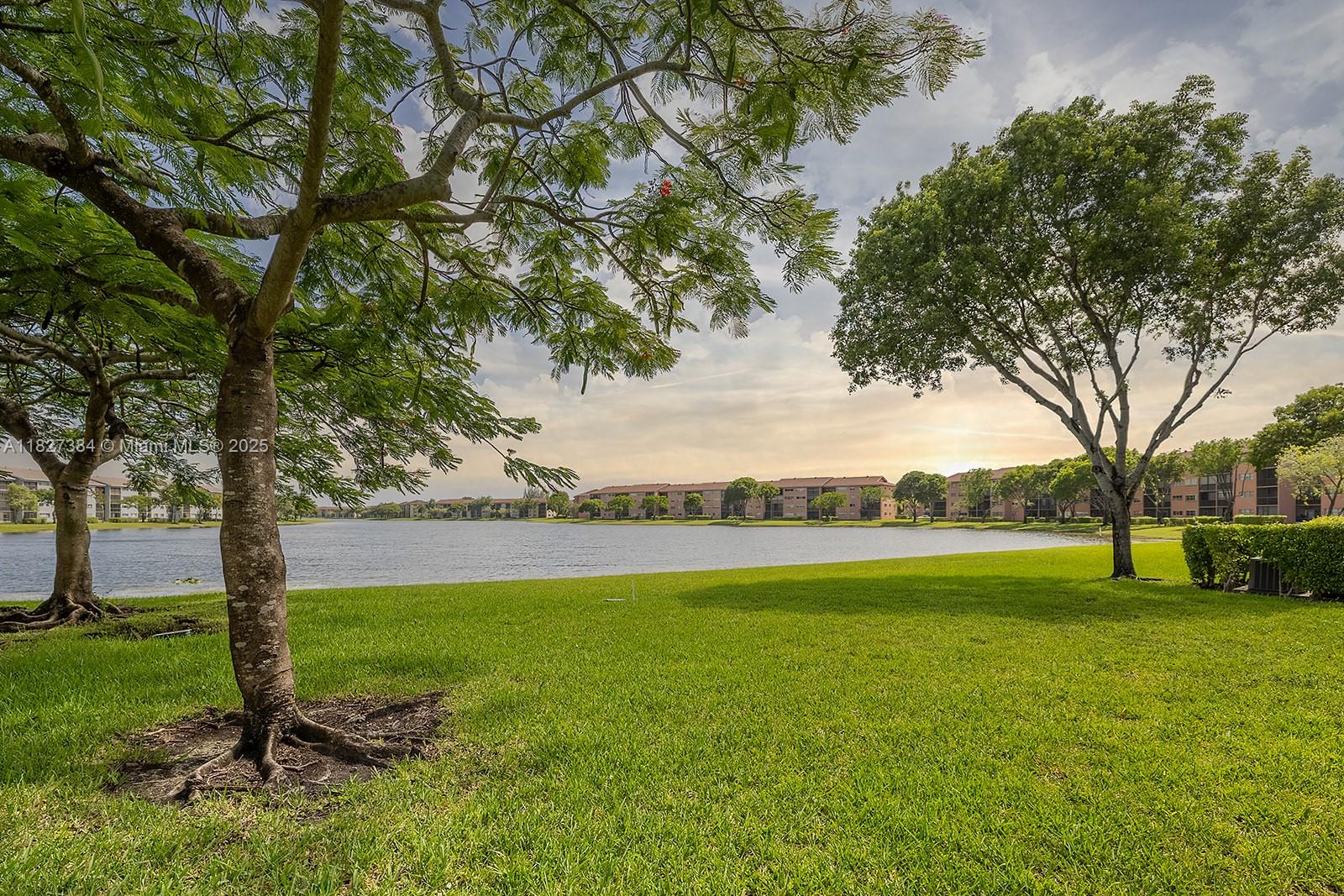Experience luxury living in this stunning breathtaking lake view on the First floor located in Century Village. This brand-new, modern unit boasts a contemporary kitchen with sleek, ceiling-high cabinets, quartz countertops, and brand-new appliances. Enjoy the beauty of brand-new vinyl flooring, freshly painted interiors, and elegant, bathrooms. Breathtaking views. Brand New Blinds, Water Heater. Premier 55+ resort-style amenities, including a state-of-the-art clubhouse, heated pools, fitness center, tennis courts, golf course, theater, social events and activities. 24-hour security, transportation services, dining, and entertainment. Assigned parking, ample guest parking. HOA monthly maintenance fee covers water, basic cable & internet, exterior building and trash removal. Parking #31