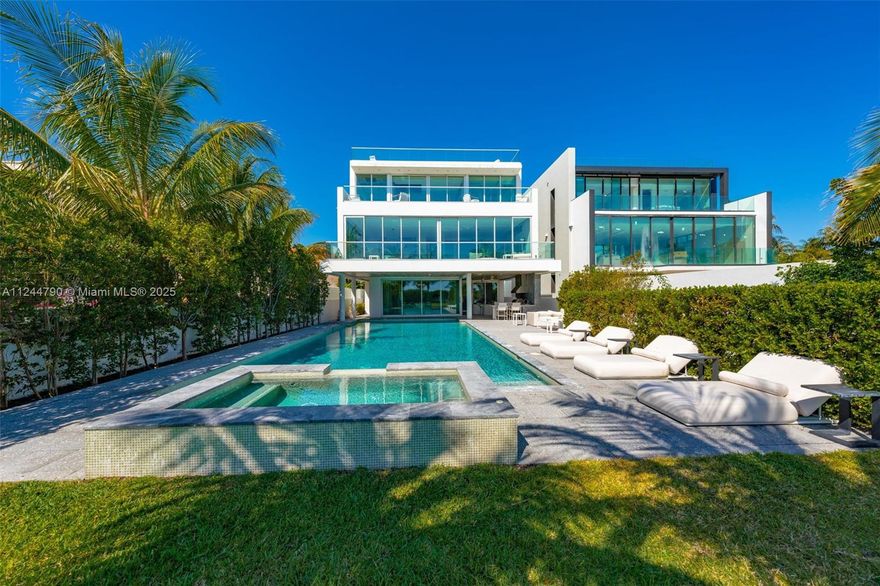 Stunning new modern construction estate in the esteemed gated Oceanfront community, Altos Del Mar. This 7 bedroom, 9.5 bathroom tri-level smart-home boasts unrivaled views of sunsets and the Atlantic Ocean. Luxury features include a private elevator, 2 custom kitchens with high-end appliances, polished Italian porcelain floors, a 300 bottle wine room, and an expansive rooftop terrace, perfect for entertaining. The extravagant master suite includes his & her master baths with custom-built closets and a private terrace with spectacular ocean views. The summer kitchen, infinity pool with jacuzzi, and private beach access make this the perfect Miami Beach home.