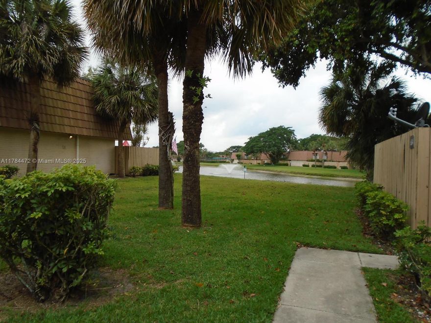 Waterside Luxury Townhomes is a non-gated community located in West Palm Beach. This townhouse with fenced patio has two master bedrooms and each has their own bathroom. Newer stainless steel appliances in kitchen with granite countertops. Tile on first floor and carpet on second floor in bedrooms. Full size newer washer and dryer. Open balcony with sliding doors from both bedrooms overlooks garden view. Community includes fitness center, pool and tennis courts. Near major roads, shopping, highways, restaurants, beaches, parks  and more. TENANT OCCUPIED UNTIL OCTOBER 31ST, 2025 and paying $2300 per month. SERIOUS BUYERS ONLY