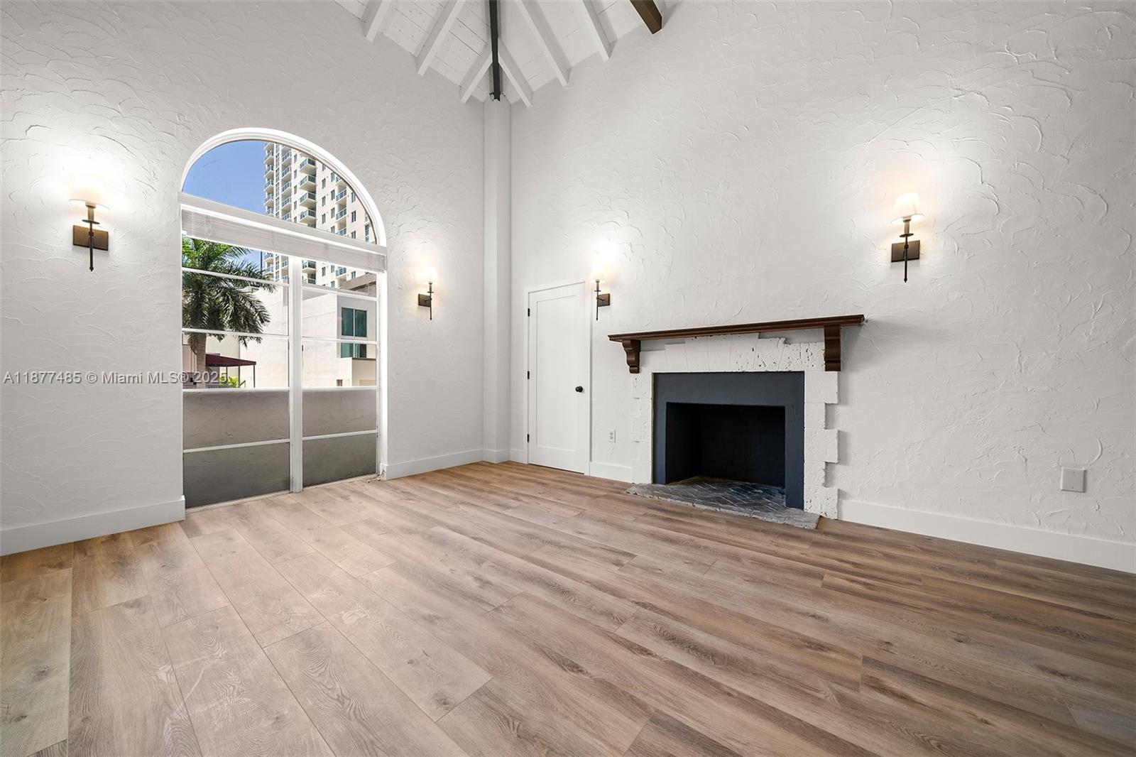 Discover this stunning rental right in the center of Edgewater! This updated 2-bedroom, 1-bath home combines modern design with warm character. The open layout feels airy and inviting thanks to vaulted ceilings and brand-new floors, while a flexible den provides the perfect spot for a guest room or office. The sleek kitchen is equipped with stainless steel appliances and a chic tile backsplash, and the renovated bathroom shines with new fixtures and clean, contemporary style. Both bedrooms feature spacious closets, giving you plenty of storage. Ideally situated on Biscayne Boulevard, you’ll be just steps from the neighborhood’s cafes, restaurants, and shops. Stylish, convenient, and move-in ready—with on-site parking for everyday ease in the city.