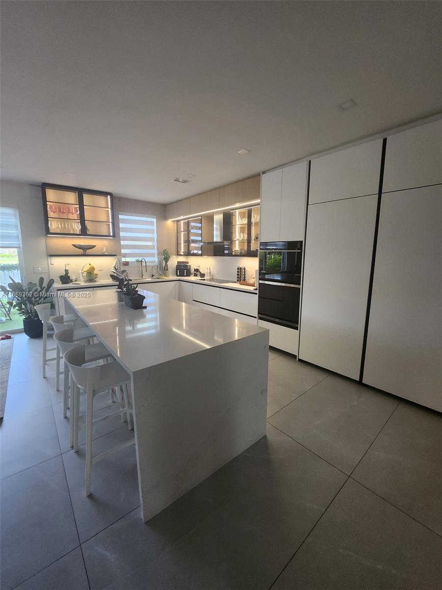 Fully remodeled 3 bed / 2.5 bath townhouse in a gated Doral community with stunning lake views. Features include a brand-new kitchen, remodeled bathrooms, new closets, new AC, impact windows, and laminate floors throughout. Located next to the Turnpike for easy access. Move-in ready and in a desirable community—don’t miss this unique opportunity!