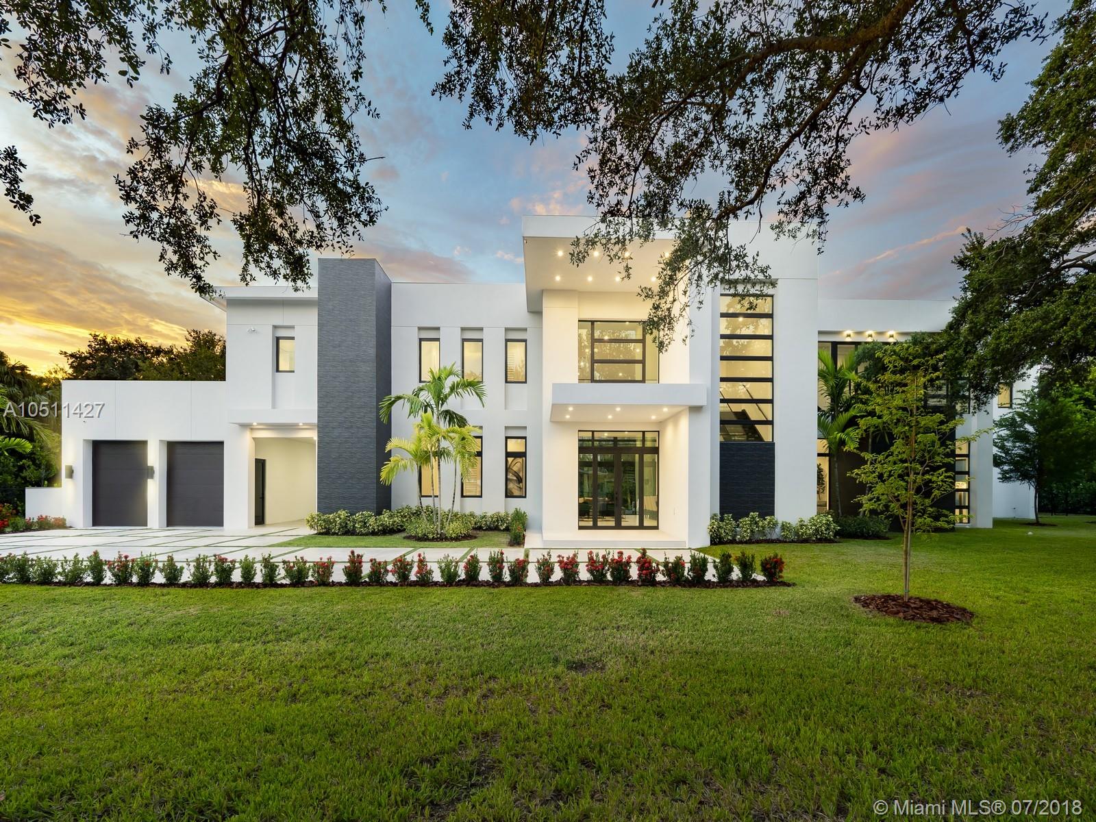 Striking 2018, Brand-New Estate built with the finest finishes. Enormous windows and doors offering plenty of natural light making this floorplan spectacular. European Kitchen cabinets, Quartz counters, Wolf & SubZero Appliances. Picture-perfect entertaining Kitchen and Family room area while enjoying flow through yard views. Estate offers 6 en-suite bedrooms with finished closets, a Media Room or additional 7th bedroom. Master Suite offers balcony overlooking the extravagant resort style pool & backyard area. Master Bath has double vanities & water closets, floating tub, & grand shower. LED Lighting & porcelain floors throughout. Other features: large covered terraces, summer kitchen, detached 2 car garages + carport. Located in very quiet and private street. Premier Pinecrest Schools.