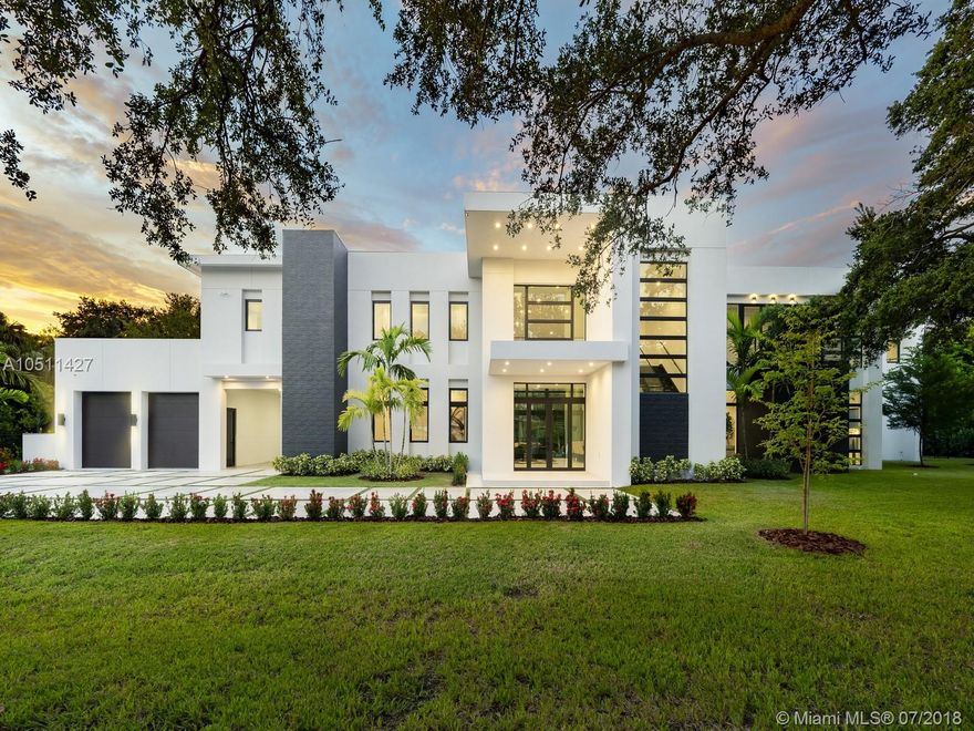 Striking 2018, Brand-New Estate built with the finest finishes. Enormous windows and doors offering plenty of natural light making this floorplan spectacular. European Kitchen cabinets, Quartz counters, Wolf & SubZero Appliances. Picture-perfect entertaining Kitchen and Family room area while enjoying flow through yard views. Estate offers 6 en-suite bedrooms with finished closets, a Media Room or additional 7th bedroom. Master Suite offers balcony overlooking the extravagant resort style pool & backyard area. Master Bath has double vanities & water closets, floating tub, & grand shower. LED Lighting & porcelain floors throughout. Other features: large covered terraces, summer kitchen, detached 2 car garages + carport.  Located in very quiet and private street. Premier Pinecrest Schools.
