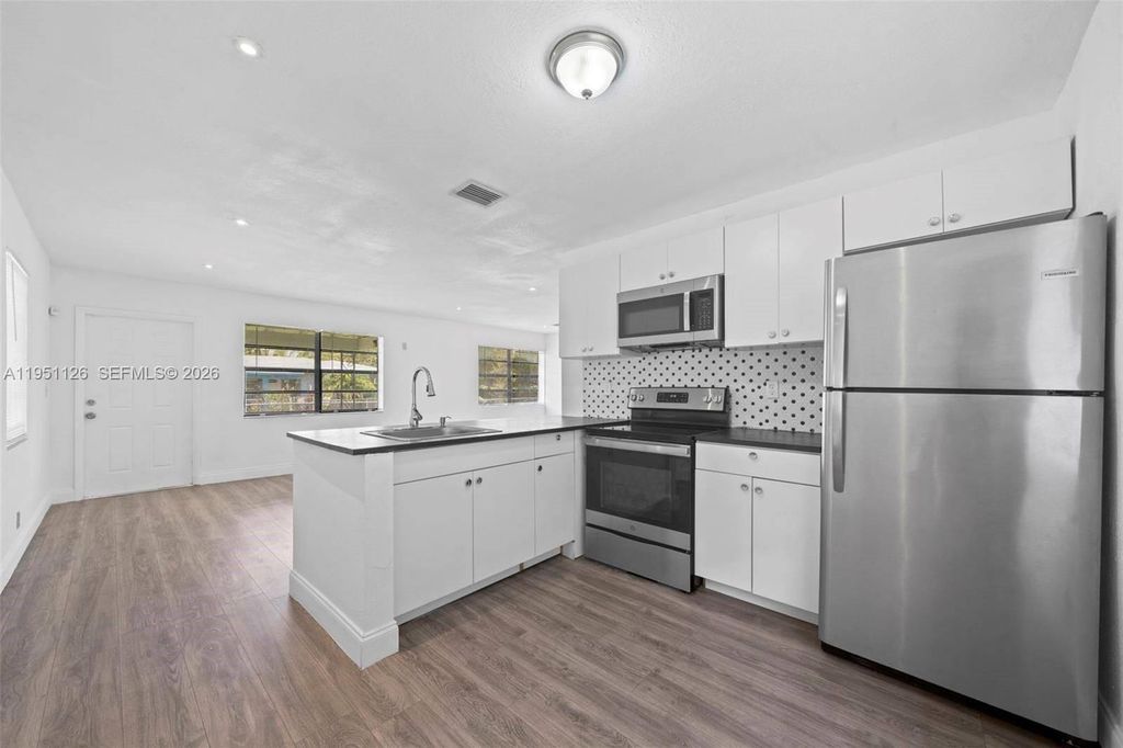 Photo of 1344 NW 7th Ter, Fort Lauderdale, FL 33311 (MLS # A11951126)