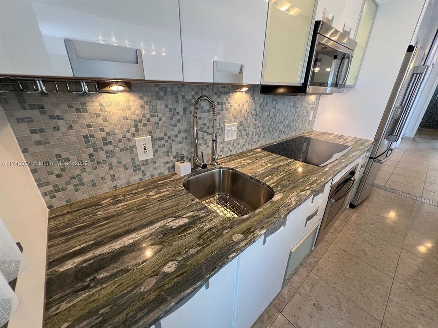 Spacious nicely repainted & renovated 1bed/1.5bath Condo with IMPACT WINDOWS and unobstructed view. A SECOND ROOM with its MURPHY BED can be also your office. 1 COVERED PARKING SPACE but with no need to take the car as the building is located in the heart of South Beach. This Condo perfectly situated on the quiet west side of Lincoln Road within walking distance to everything Miami Beach has to offer: Trader Joe's, Whole Foods, Publix and a few short steps to trendy restaurants and boutiques of Sunset Harbor. Low HOA fees billed quarterly and high rents in this area make it a perfect investment opportunity as well. This area is Miami Beach's best kept secret !