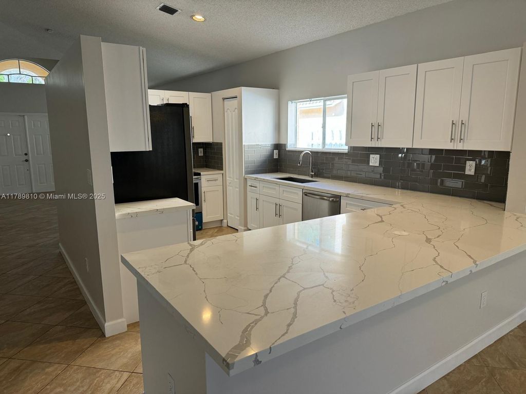 Photo of 13500 NW 7 St, Plantation, FL 33325 (MLS # A11789810)