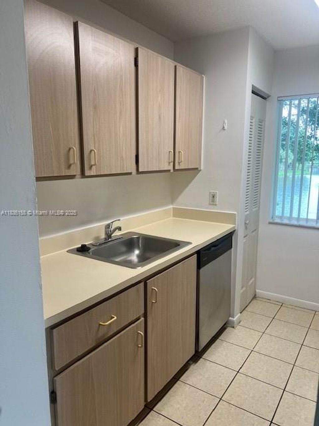 Photo of 10765 Cleary Blvd #202, Plantation, FL 33324 (MLS # A11836158)