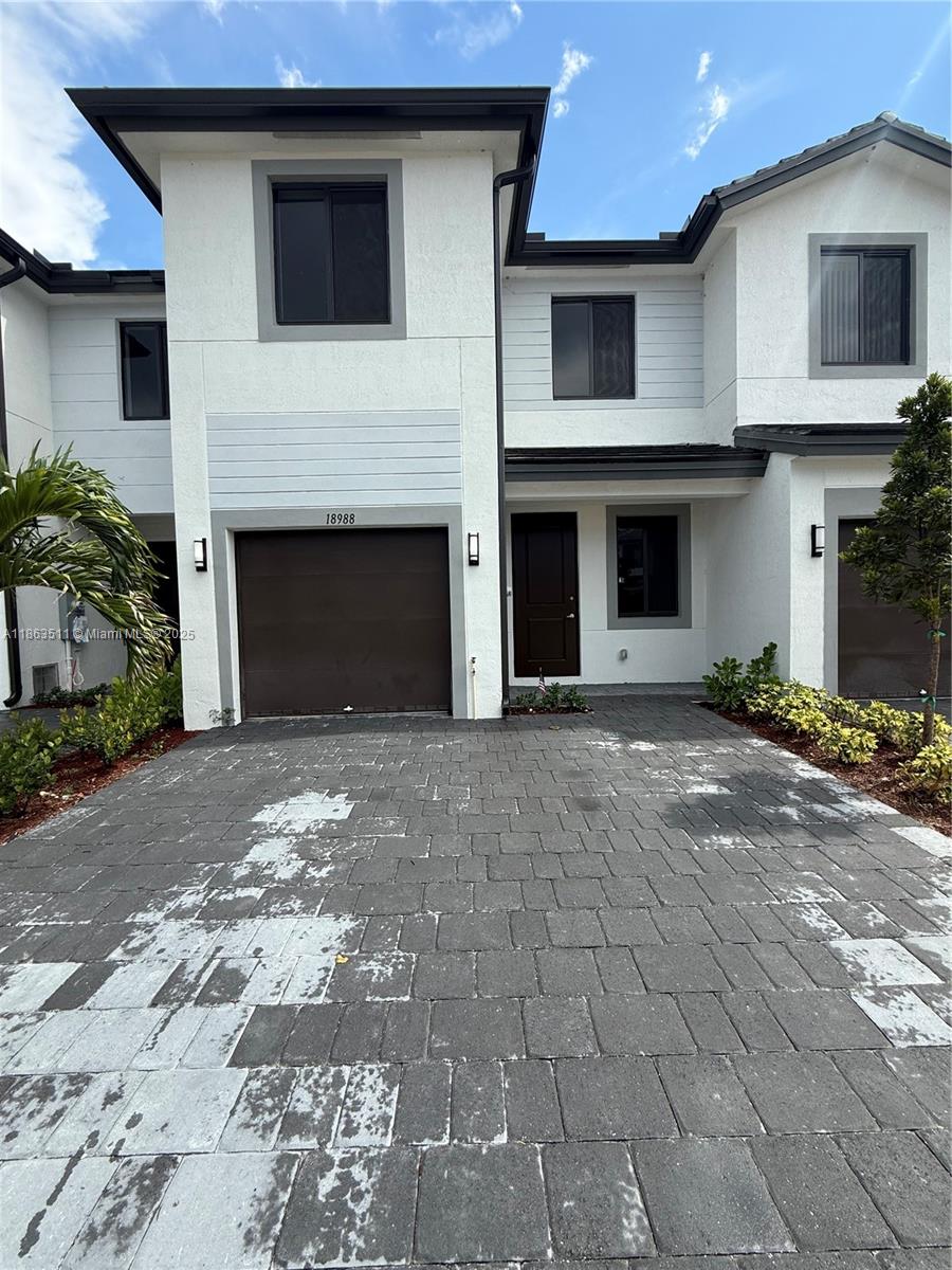 BRAND NEW!! Be the first to live in this beautiful 4/2/1 Townhome located in the Century Park Square community. This modern unit features tiled floors downstairs, laminate flooring upstairs, brand new dishwasher, microwave, stove, refrigerator washer and dryer. One car garage to protect your car and extra storage. Impact windows and doors, second floor is CBS construction for added peace of mind. Fenced backyard for added privacy and entertaining guests. This community features a beautiful park/green space for evening walks or exercise. Located near shops, major highways. Rent includes Cable and Internet!! Don't wait! This unit will not last!!