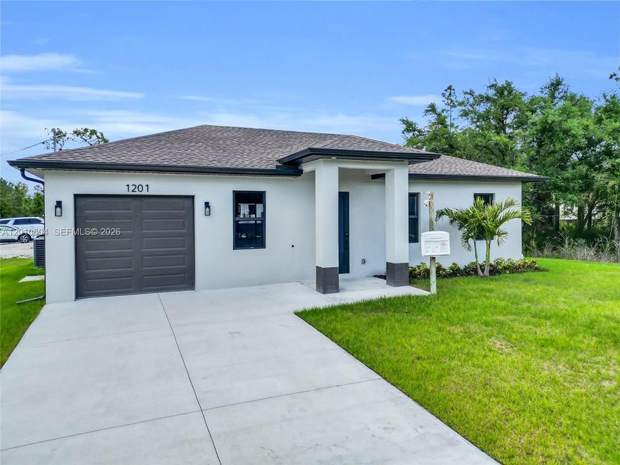 SELLER CONTRIBUTION AVAILABLE!!! This beautiful, brand-new construction home features 3 beds, 3 full baths, and a one-car garage. Located in a desirable neighborhood, this home features an open-concept layout with elegant gray tile flooring throughout, ideal for easy maintenance and a clean, modern look. Stainless steel appliances, large quartz island, ample cabinetry. This beautiful home features a charming gazebo in the backyard, perfect for enjoying Florida's stunning sunsets. Located in a corner lot with plenty of room for a pool, this move-in-ready home is a rare find. Don't miss your opportunity to own a piece of paradise!