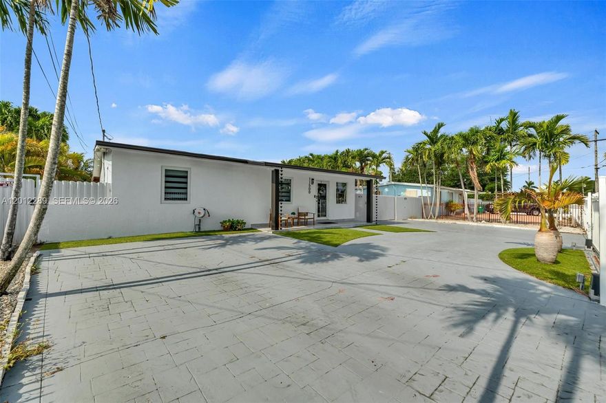 Fully upgraded property: new kitchen, renovated bathrooms, new terrace, impact doors and windows, electric gate with new motor and rollers, and new pergola with outdoor kitchen overlooking the lake. Spacious side parking with room for an RV or boat. Independent access from both sides. New electrical panel and A/C replaced in 2022.Don’t miss the opportunity to own this excellent property, ideal for family living and enjoyment or as an investment. Located in a prime Miami area, just minutes from access to the Turnpike.