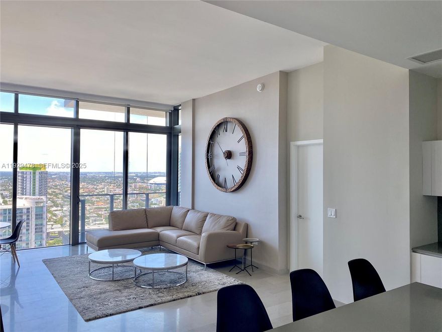 LIVE IN THE CENTER OF IT ALL! Ditch your car and live just one elevator ride away from amazing restaurants, shopping, downtown business district, farmer's market, Metrorail, parks, Equinox gym, and Miami's amazing nightlife. This REACH residence offers sweeping city and bay views, 12ft ceilings, floor-to-ceiling sliding glass doors, Italian cabinetry for both kitchen and baths, large finished walk-in closets, quartz countertops, wine fridge, and top of the line appliance. Master includes dual sinks, frameless glass shower, separate soaking tub, and mosaic backsplash. Building features expansive half-acre amenity deck tropically landscaped, hammam spa, bbq area, outdoor/indoor fitness & children's areas. Priced to sell, this opportunity is not to be missed! Best one bedroom !!!!