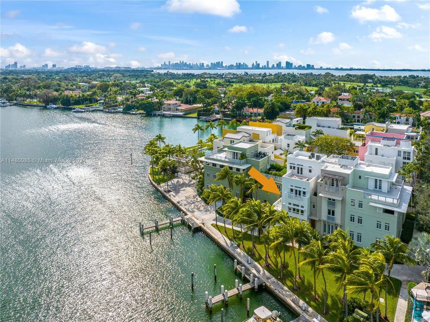 Premier Island Living on Private Aqua Island! This exceptional corner townhouse is nestled right on the water's edge, offering panoramic water views, 3 exposures, a private 40' deeded dock, & a 2-car garage. Boasting 5BD + den, 4.5BA, elevator, foyer entry, exquisite finishes & details, soaring high ceilings, impact windows & doors, elegant sun drenched interiors, electric blinds & an open gas kitchen. Enjoy a spacious primary suite on its own floor w/custom built office, private balcony, & bath w/dual sinks & separate tub & shower. Complete w/motorized shades in the living room & primary. Entertain in style w/multiple balconies & a 4th floor tower studio w/wet bar, fridge & 2 rooftop terraces. The ultimate address for those who crave privacy, boating & a hassle free lifestyle.