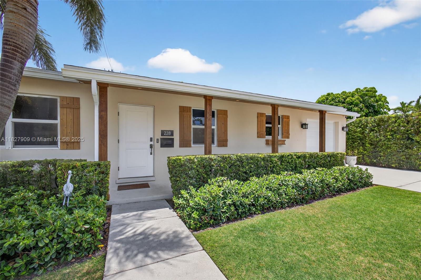 This turnkey 3-bedroom, 2-bath pool home with an office/den is located on a quiet cul-de-sac in one of West Palm Beach’s most sought-after neighborhoods "SoSo". A private easement at the end of the street offers easy access to scenic Intracoastal walks along Flagler Dr. The backyard is a true oasis—ideal for relaxing or entertaining—with a heated saltwater pool, covered patio with custom awning, expansive travertine deck, and low-maintenance turf yard. Inside, the spacious open-concept kitchen boasts stainless steel Bosch appliances and a premium water filtration system. The air-conditioned garage serves as a versatile exercise room with abundant storage plus washer/dryer. Additional features include hurricane-impact windows and doors, a newer roof from 2017, and a Tesla charging hookup.