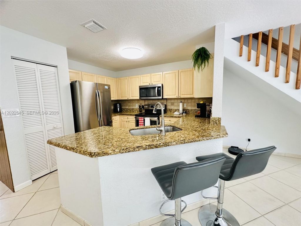 Photo of 8952 NW 38th Dr, Coral Springs, FL 33065 (MLS # A12022645)
