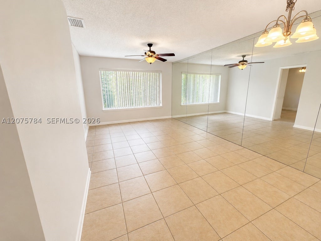 Photo of 3280 NW 102nd Ter #203-E, Coral Springs, FL 33065 (MLS # A12075784)