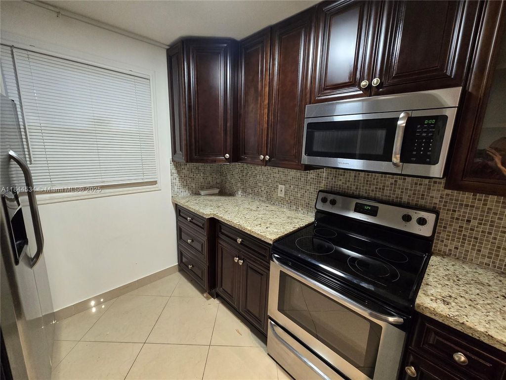 Photo of 115 Royal Park Dr #2H, Oakland Park, FL 33309 (MLS # A11844534)