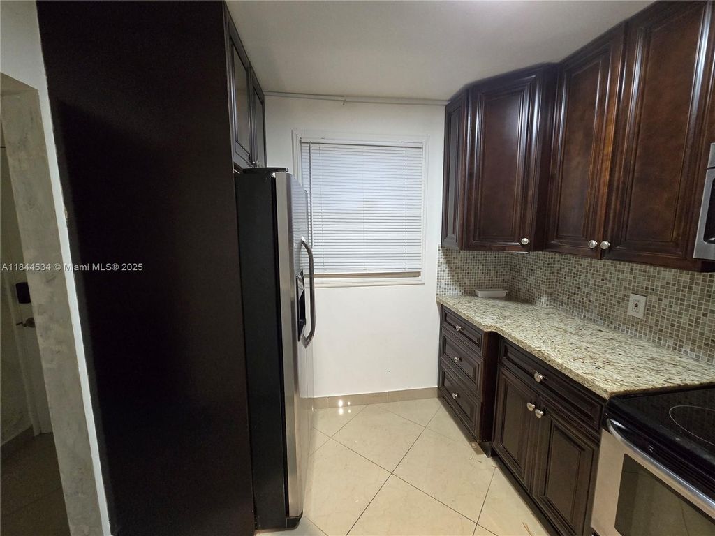 Photo of 115 Royal Park Dr #2H, Oakland Park, FL 33309 (MLS # A11844534)