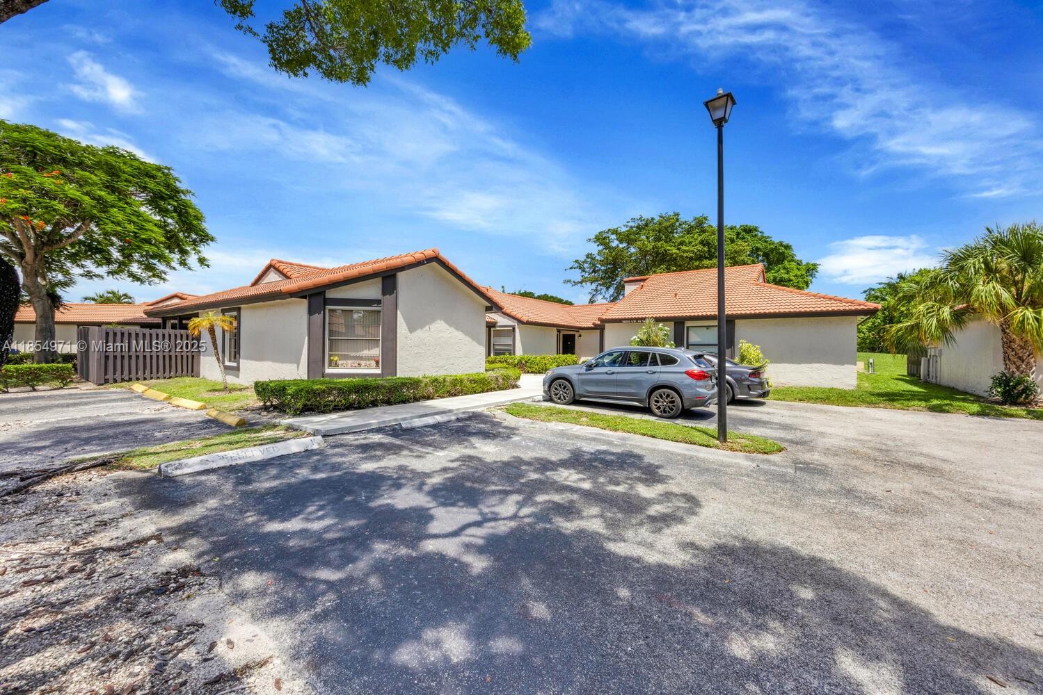 Completely updated 3BR/2BA corner townhome in the highly desirable Lakes of the Meadows - Village Homes. Single-story layout with vaulted ceilings, hurricane impact windows, updated flooring, open kitchen w/ custom cabinets, granite counters, and new SS appliances. Spacious primary suite w/ large walk-in closet & oversized en-suite bath. Covered patio, fenced yard, and extra storage. No rear neighbors—backs to greenbelt. Enjoy resort-style amenities: clubhouse, pools, gym, tennis, pickleball, basketball, walking trails & more. 24/7 roving security. Close to shopping, dining & top-rated schools. Buy with confidence as this home has been pre-inspected!