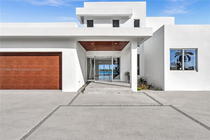 Newly constructed Westwood Lakes home.   Stunning Two-Story waterfront retreat with Spacious Living and a roof top deck.     Welcome to this exceptional two-story residence that was completed in 2025.  Boasting 5 spacious bedrooms and 6.5 bathrooms, this home offers the perfect balance of sophistication and functionality with waterfront views.  Step inside to soaring ceilings and an open-concept layout, where natural light floods the living spaces. The kitchen, complete with high-end appliances and stylish finishes, is a chef’s dream, ideal for entertaining and everyday living. Located on a motorized lake. 

Upstairs, the serene primary suite serves as a private oasis, featuring a spa-like en-suite bath and generous walk-in closet.