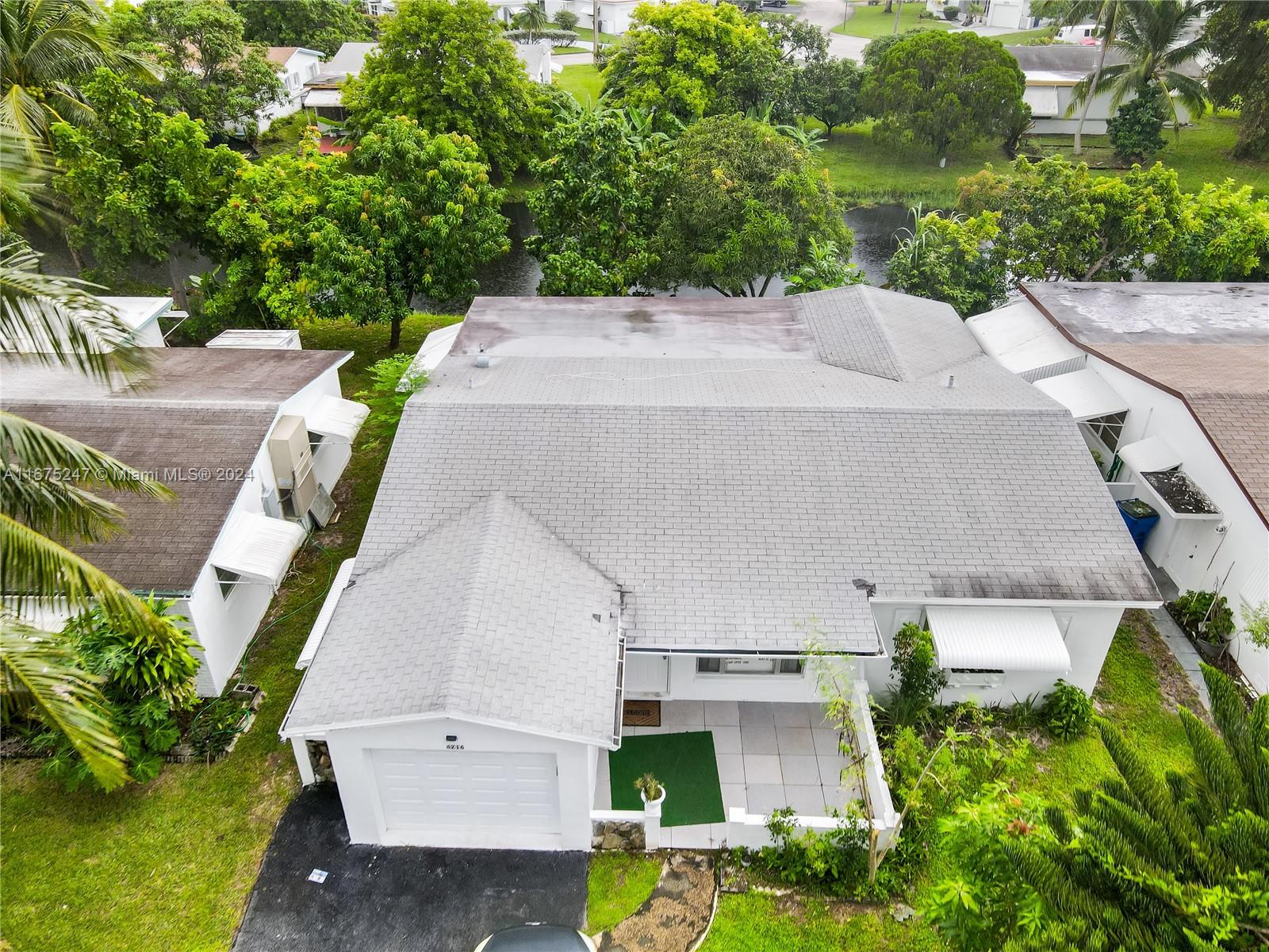 Charming 2-Bed, 2-Bath Home and 1 Car Garage with Canal View in 55+ Community – Lauderdale Lakes
Welcome to this spacious 2-bedroom, 2-bathroom home nestled in a peaceful 55+ community in Lauderdale Lakes. This beautifully maintained property features an updated kitchen, a large primary bedroom, and a versatile Florida room currently used as a living room/bedroom, perfect for relaxing or hosting guests. Enjoy scenic canal views from your backyard and the convenience of a 1-car garage. The roof is just 11 years old, ensuring long-term durability. Located in a quiet neighborhood, this home offers a flexible move-in date, making it a great option for buyers seeking comfort and convenience.