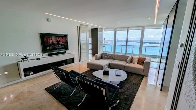 Stunning 2-bedroom, 2.5-bath unit with a den, offering 1,730 sq ft of living space. The kitchen features sleek Italian cabinetry, granite countertops, stainless steel appliances, a wine cooler, and a built-in cappuccino maker. Enjoy an expansive balcony with breathtaking views of Biscayne Bay, Miami Beach, and Key Biscayne. The building boasts a 31,000 sq ft amenities level, including a state-of-the-art fitness center, infinity-edge pool, spa, and rooftop community center. Additional features include a business center, full-service concierge, 24-hour valet parking, one assigned parking space on the second floor, and a climate-controlled storage unit. Prime location.