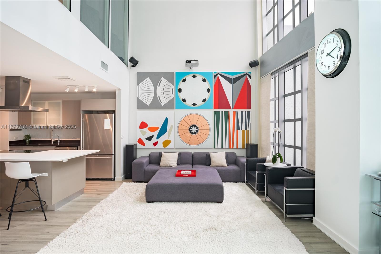 Experience soaring 25’ ceilings in this 1,668 SF luxury loft in Midtown Miami. Configured as two bedrooms + three bathrooms, it features an open layout anchored by a modern kitchen with oversized island. Perfectly positioned between Edgewater, the Design District, and Wynwood, Midtown is the locals’ choice for central living with Whole Foods, Trader Joe’s, Starbucks, Target, gyms, and fitness studios nearby. This residence offers space to entertain or relax, with resort-style amenities including pool, new gym, steam room, sauna, 24/7 front desk, secure elevators, and more. 4Midtown provides a lifestyle where comfort and convenience meet. Pet-friendly building with flexible layout options and natural light make this an outstanding opportunity in one of Miami’s most dynamic neighborhoods.