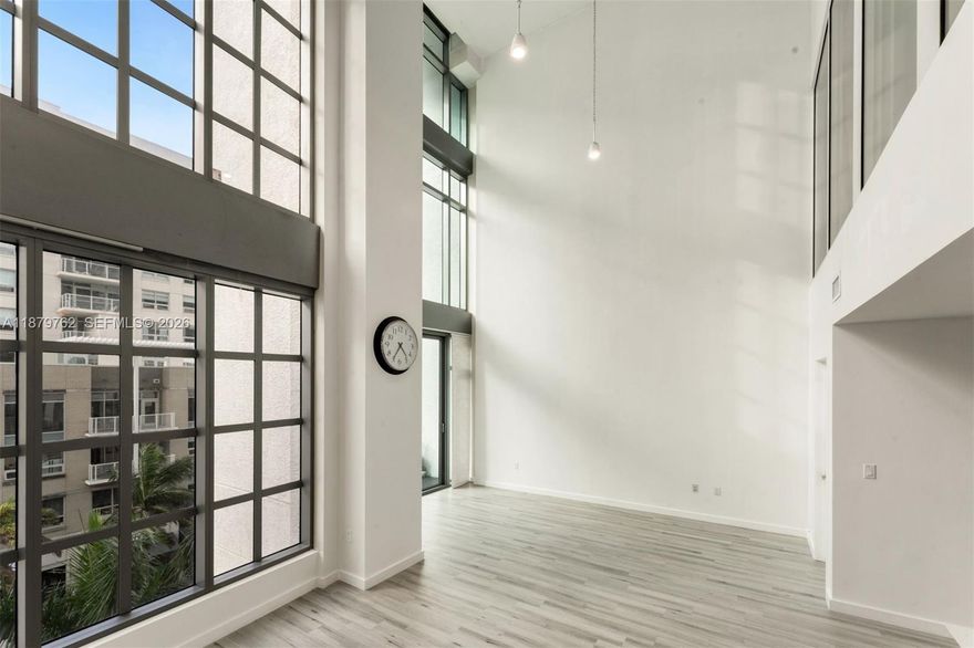 NOTE: TENANT OCCUPIED TIL 1.7.27. Experience soaring 25’ ceilings in this 1,668 SF luxury loft in Midtown Miami. Configured as two bedrooms + three bathrooms, it features an open layout anchored by a modern kitchen with oversized island. Perfectly positioned between Edgewater, the Design District, and Wynwood, Midtown is the locals’ choice for central living with Whole Foods, Trader Joe’s, Starbucks, Target, gyms, and fitness studios nearby. This residence offers space to entertain or relax, with resort-style amenities including pool, new gym, steam room, sauna, 24/7 front desk, secure elevators, and more. 4Midtown provides a lifestyle where comfort and convenience meet. Pet-friendly building with flexible layout options and natural light make this an outstanding opportunity in one of Miami’s most dynamic neighborhoods.