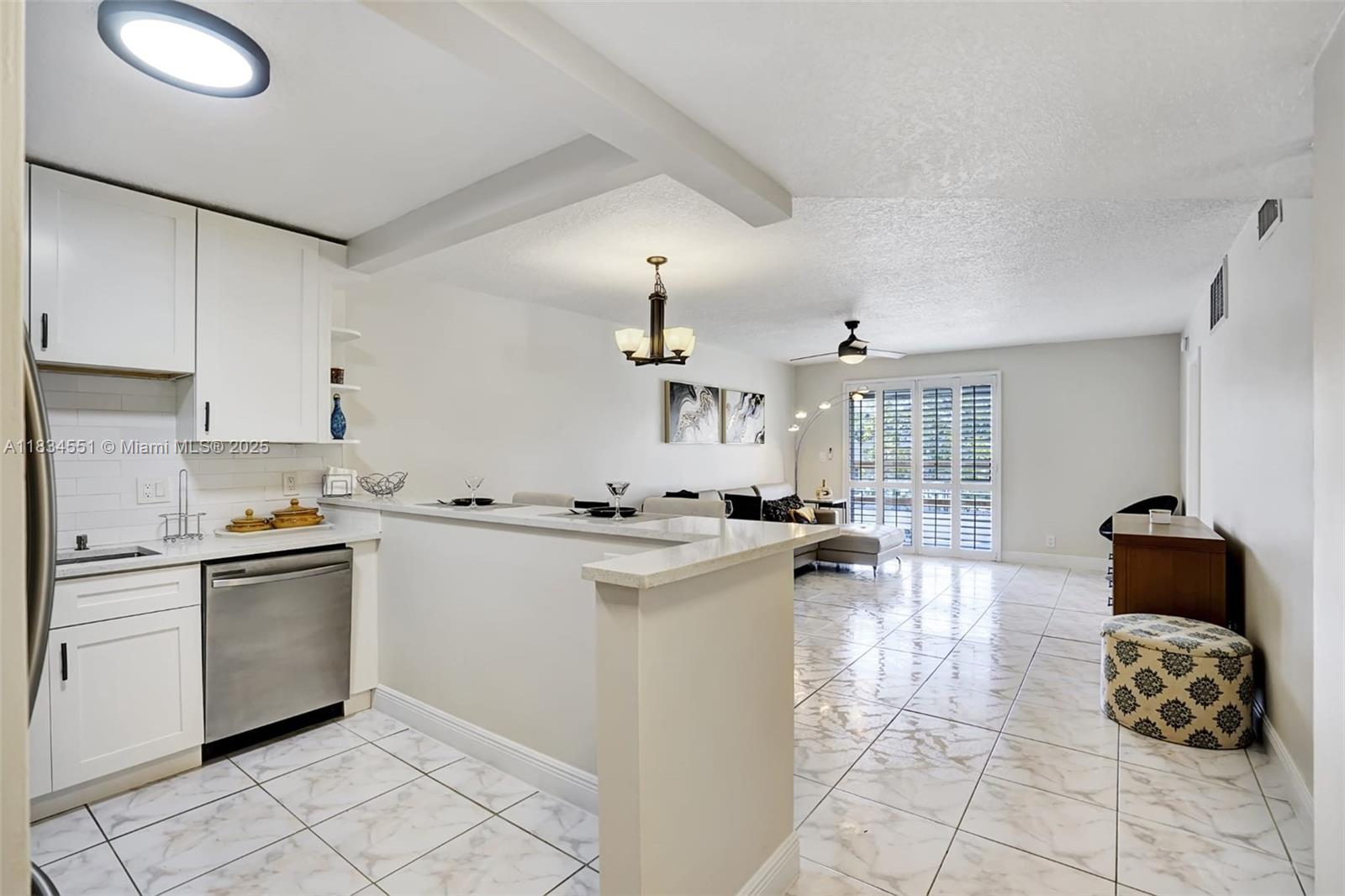 Bright 2BR/2BA corner condo in Barcelona North! Second-floor unit w/ screened balcony & large closets. Community offers a heated pool, sauna, 2 tennis courts, clubhouse, shuffleboard & billiards. On-site laundry. Just minutes to I-95 & Dixie Hwy, and only ~8 min to the beach. HOA covers common area maintenance. Great location for commuters & beach lovers!