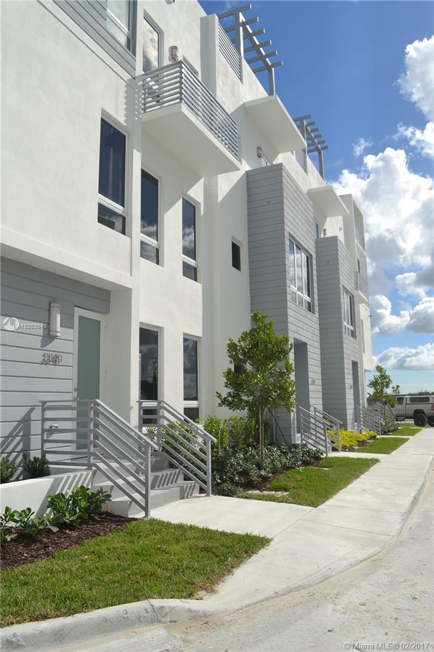 Brand new Luxury contemporary townhome in Doral. 4 Bedrooms 3 bathrooms, 4 story townhome near Southern command. Rooftop terrace with summer kitchen.