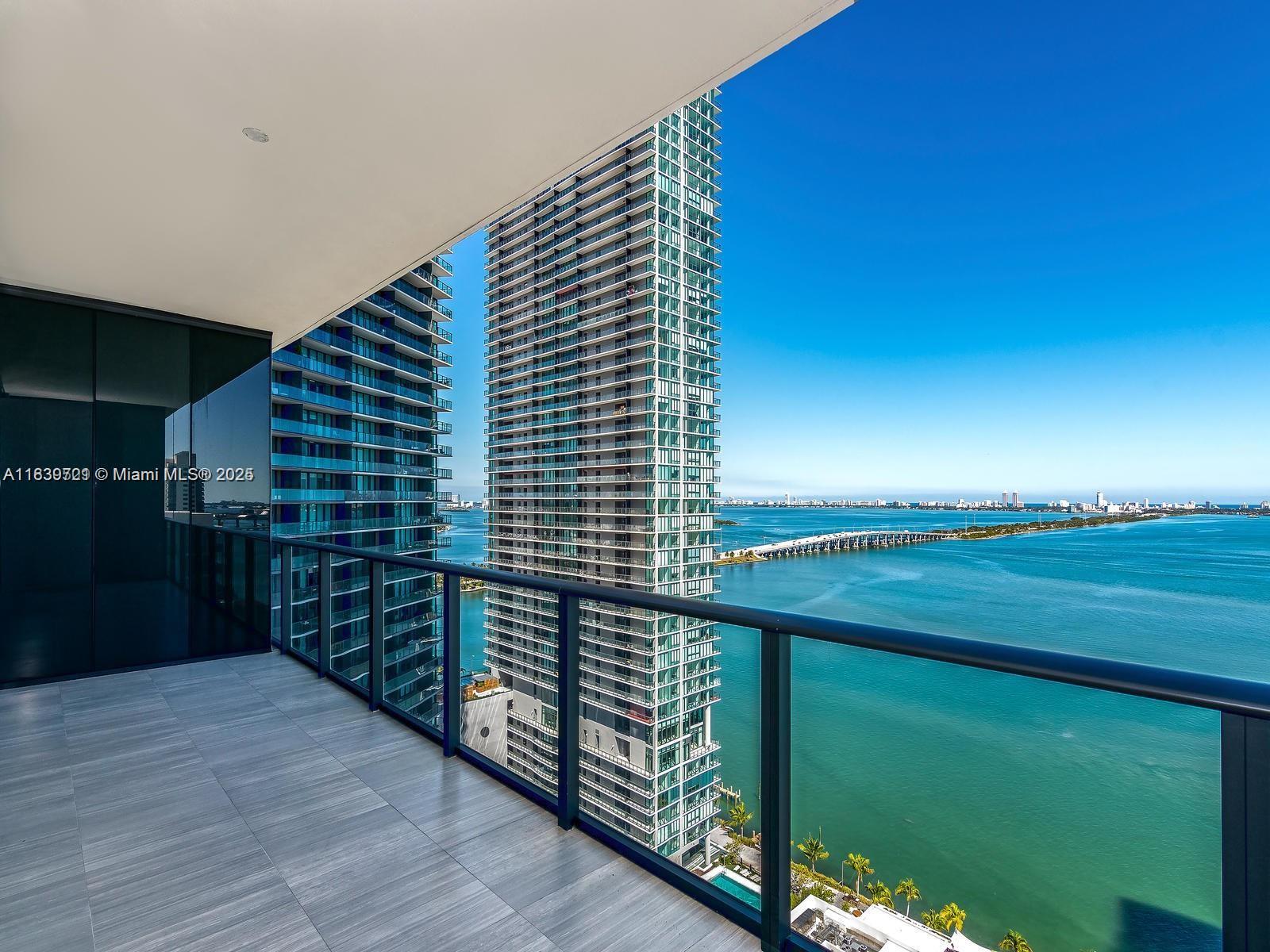 Gran Paraiso’s luminous 2-bedroom, 3-bath sky residence commands unobstructed Biscayne Bay and city vistas through ten-foot window walls. From the private elevator, a flow-through layout unfolds elegant cabinetry and a chef’s kitchen with integrated Sub-Zero, Bosch and Wolf appliances. A 215-sq-ft terrace joins living room and suites. Owners enjoy a two-acre deck with lagoon pool, cabanas, clay tennis, bowling, golf simulator, spa, spin studio, cinema, wine cellar, cigar lounge and elegant club rooms, plus Amara and dozens of shops downstairs. Additional perks include a business hub, children’s play suite and 24-hour concierge. Whole Foods opacross the street; the Design District, Midtown, Wynwood and Miami Beach lie minutes away. Private parking & valet.