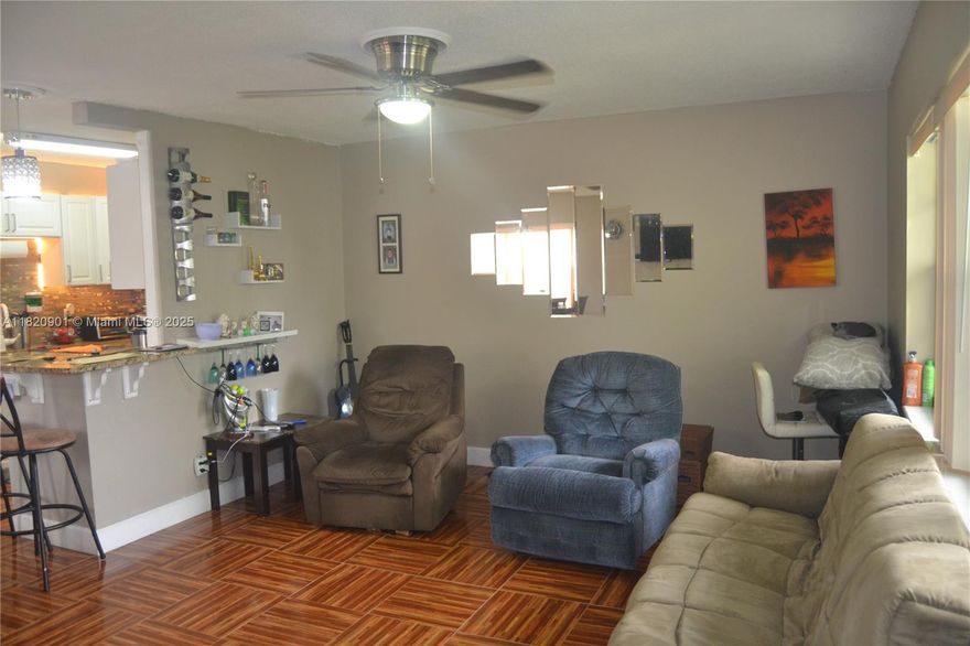 Beautiful and totally remodeled 1 bedroom, 1.5 bathrooms condo located in a wonderful retirement 55+ community.  Interior of the home includes wood laminate flooring throughout, updated kitchen with granite counters, wood cabinets and updated appliances. Bathroom has also been tastefully updated. Exterior of the unit includes accordion shutters, and a nice private screened in terrace.  Gated and secured 24/7. Amenities also include large clubhouse, Olympic size pool, tennis courts, golf course, gym, and even community bus to take you to and from shopping expeditions.  Very close to major shopping centers and restaurants.  Come to this unit and you will be the next owner.