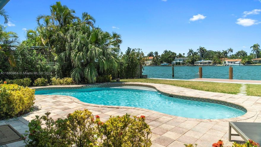 Discover an exquisite waterfront Spanish-style villa on Treasure Island, offering breathtaking views of Miami Downtown and Biscayne Bay. This unique property features 4 luxurious bedrooms, including a master suite with a private balcony overlooking the ocean. Step into a world of elegance, where every detail reflects Spanish architectural charm, from the traditional tile roofing to the beautifully designed interiors. This home is perfect for those who appreciate both style and comfort. The outdoor BBQ area, sun deck, and pool are ideal for hosting gatherings or simply soaking up the Miami sun. The private dock allows easy access for boating enthusiasts to explore the surrounding waters.