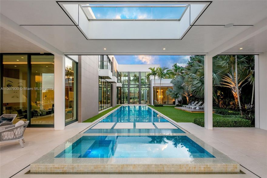 Welcome to 160 Spyglass Ln, a remarkably contemporary waterfront estate nestled among the elegance of Jupiter’s coveted Admiral’s Cove. Masterfully designed by Affiniti Architects, intricate stone & wood finishes accentuate the home throughout, perfectly complementing its 23-foot ceilings, pristine glass façades and spacious living areas. Inside, lavish first-floor master & guest suites give way to luxurious highlights including state-of-the-art Crestron home automation & designer appliances, a gourmet chef’s kitchen & custom wine vault. Outside, the estate’s defining sky deck overlooks its sophisticated spaces below, including a pool & spa w/ full cabana, designer summer kitchen and 100 feet of pristine, protected dockage w/ partial Intracoastal waterfront views - a true boater’s delight